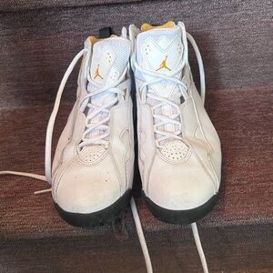 Air Jordan White, Gold, and Black Sneakers